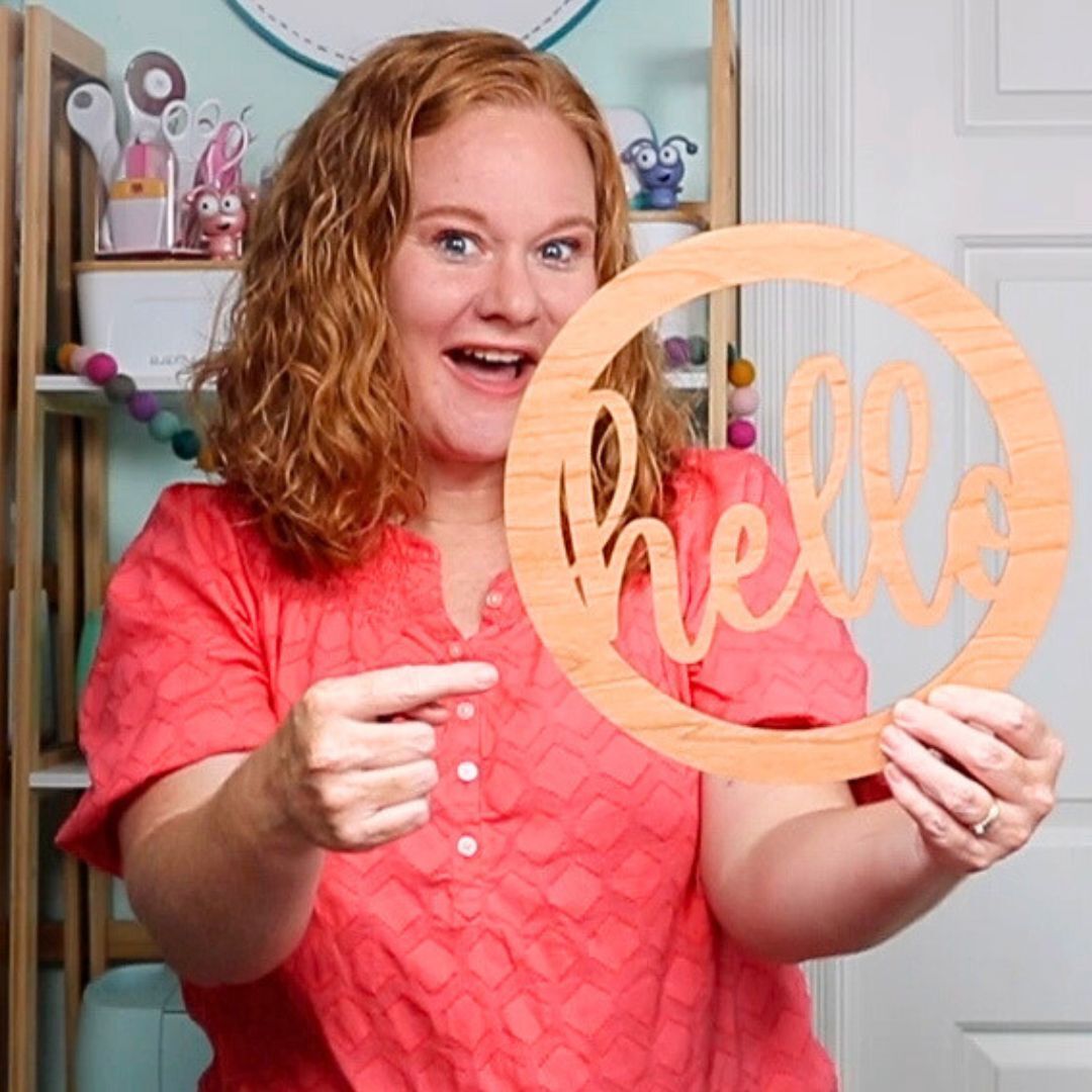 angie holden with hello sign cut on laser